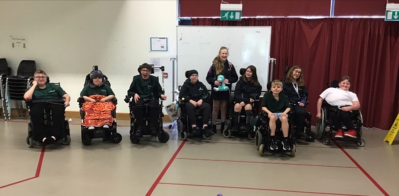 Students from Angmering School posing for a photo with Treloar School students