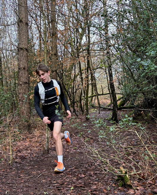 Treloar's student support assistant Tvon running in the woods, training for the London marathon