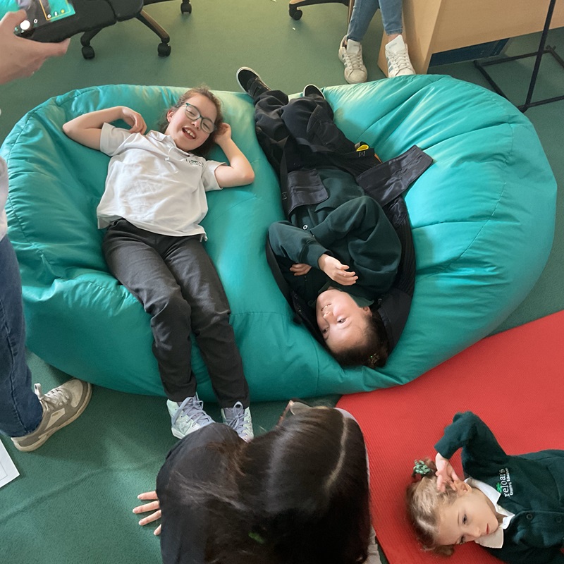 Primary students lying on beanbags during of their Student Voice sessions